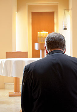 Cardinal-designate Joseph W. Tobin prays in the chapel at the Archdiocesan Center in Newark, N.J., before addressing the media on Nov. 7, the day he was introduced as the new shepherd of the Archdiocese of Newark. (Photo by Deacon Al Frank, Archdiocese of Newark)