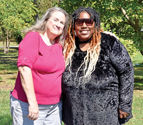 Savanna McPherson, right, smiles with Linda Kile, executive director and president of Great Lakes Gabriel Project, at Garfield Park in Indianapolis on Oct. 5. McPherson credits the organization and parish-based Gabriel Project volunteers with saving her now-21-year-old son from abortion and serving as “the wind under” her wings for two decades. (Photo by Natalie Hoefer)