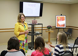 Popular Catholic author Lisa Hendey, founder of the website CatholicMom.com, chats with attendees of the Sept. 17 Gather in Faith Women's Conference before her presentation.